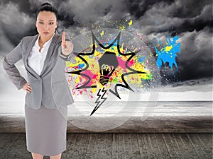 Composite image of asian businesswoman pointing