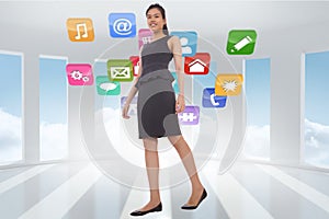 Composite image of asian businesswoman walking