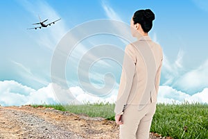 Composite image of asian businesswoman walking