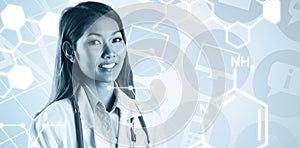 Composite image of asian doctor with stethoscope looking at camera
