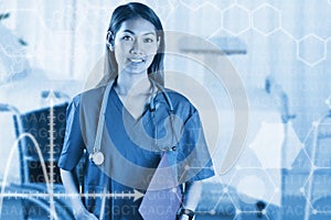 Composite image of asian nurse with stethoscope looking at the camera