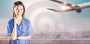 Composite image of asian nurse thinking with hand on chin