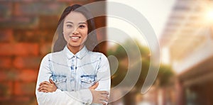 Composite image of asian woman with arms crossed smiling