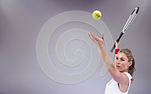 Composite image of athlete holding a tennis racquet ready to serve