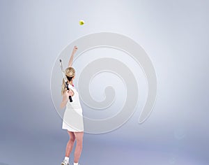 Composite image of athlete holding a tennis racquet ready to serve