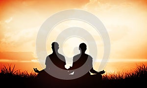 Composite image of attractive couple in white meditating in lotus pose