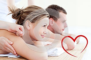 Composite image of attractive young couple having an acupunctre therapy