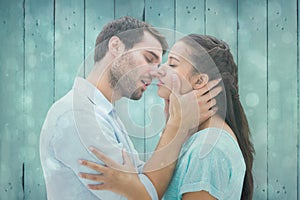 Composite image of attractive young couple about to kiss