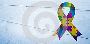 Composite image of autism awareness ribbon