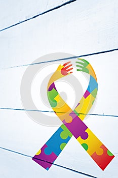 Composite image of autism awareness ribbon