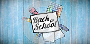 Composite image of back to school text on paper with pen