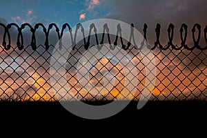 Composite image of barbed wire fence by white background