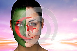 Composite image of beautiful brunette in algeria facepaint