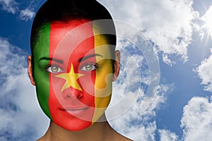 Composite image of beautiful brunette in cameroon facepaint