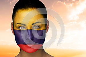 Composite image of beautiful brunette in colombia facepaint