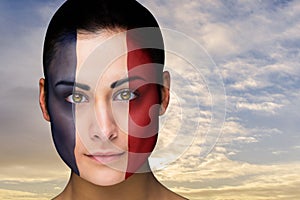 Composite image of beautiful brunette in france facepaint