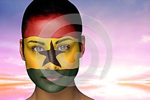 Composite image of beautiful brunette in ghana facepaint