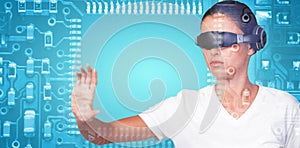 Composite image of beautiful woman gesturing while using virtual video glasses