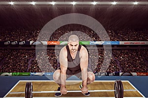 Composite image of bodybuilder lifting heavy barbell weights