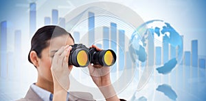 Composite image of brunette businesswoman looking through binoculars