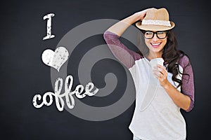 Composite image of brunette with disposable cup