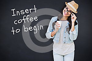 Composite image of brunette with disposable cup