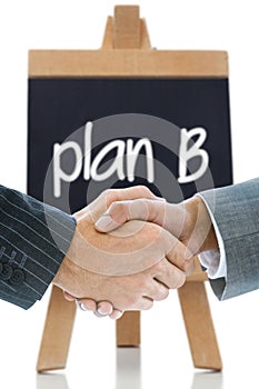 Composite image of business handshake against plan b