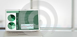 Composite image of business interface with graphs and data