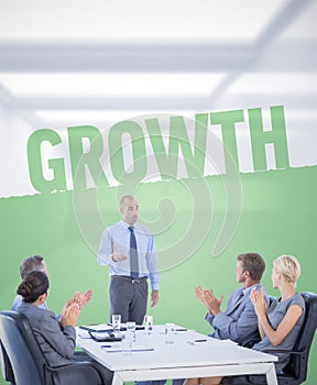 Composite image of business people applauding during meeting