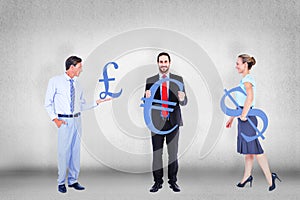 Composite image of business people holding cogs