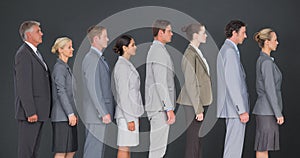 Composite image of business team standing in row