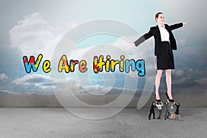 Composite image of business team supporting boss