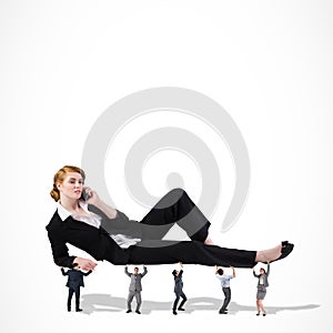 Composite image of business team supporting boss
