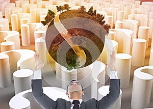 Composite image of businessman with arms raised