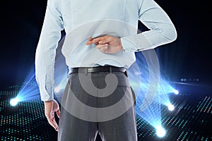 Composite image of businessman crossing fingers behind his back