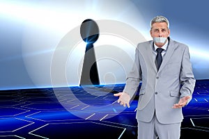 Composite image of businessman gagged