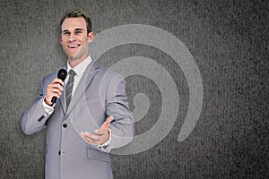 Composite image of businessman giving speech