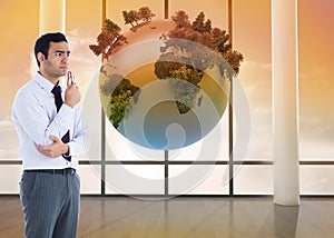 Composite image of businessman holding glasses