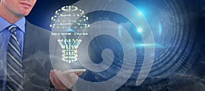 Composite image of businessman holding mobile phone