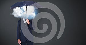 Composite image of businessman holding umbrella on white background