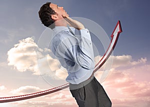 Composite image of businessman standing with arms pushing up