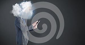 Composite image of businessman using his tablet pc