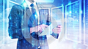 Composite image of businessman using his tablet pc