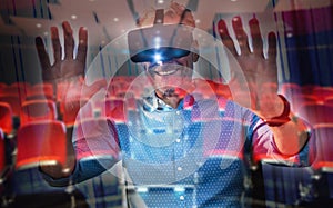 Composite image of businessman using an oculus