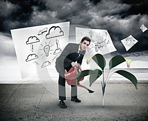 Composite image of businessman watering with red can