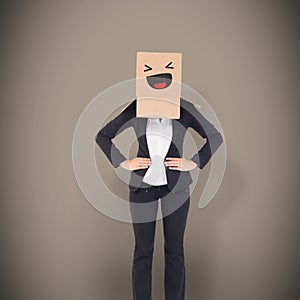 Composite image of businesswoman with box over head