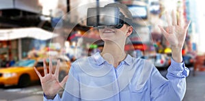 Composite image of businesswoman experiencing virtual reality