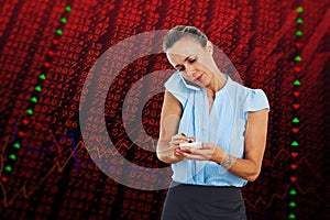 Composite image of businesswoman having a phone call and taking notes