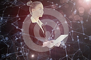 Composite image of businesswoman holding tablet