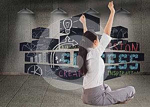 Composite image of businesswoman sitting cross legged cheering